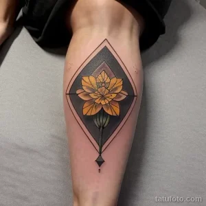 yellow carnation tattoo on the calf tatufoto.com 357
