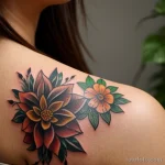 young woman with a colorful tattoo sleeve, looking thoughtfully at her arm tatufoto.com 006
