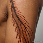 close up of rib curve, deep brown skin with vertical vitiligo band, dotwork sunburst tattoo exploding from pigment center, preci 2025 №14 - фото tatufoto.com