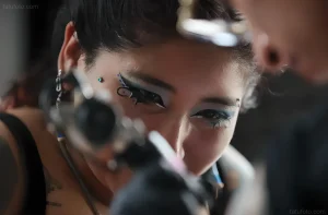Close-up of Daniela Artemisa with intricate face paint