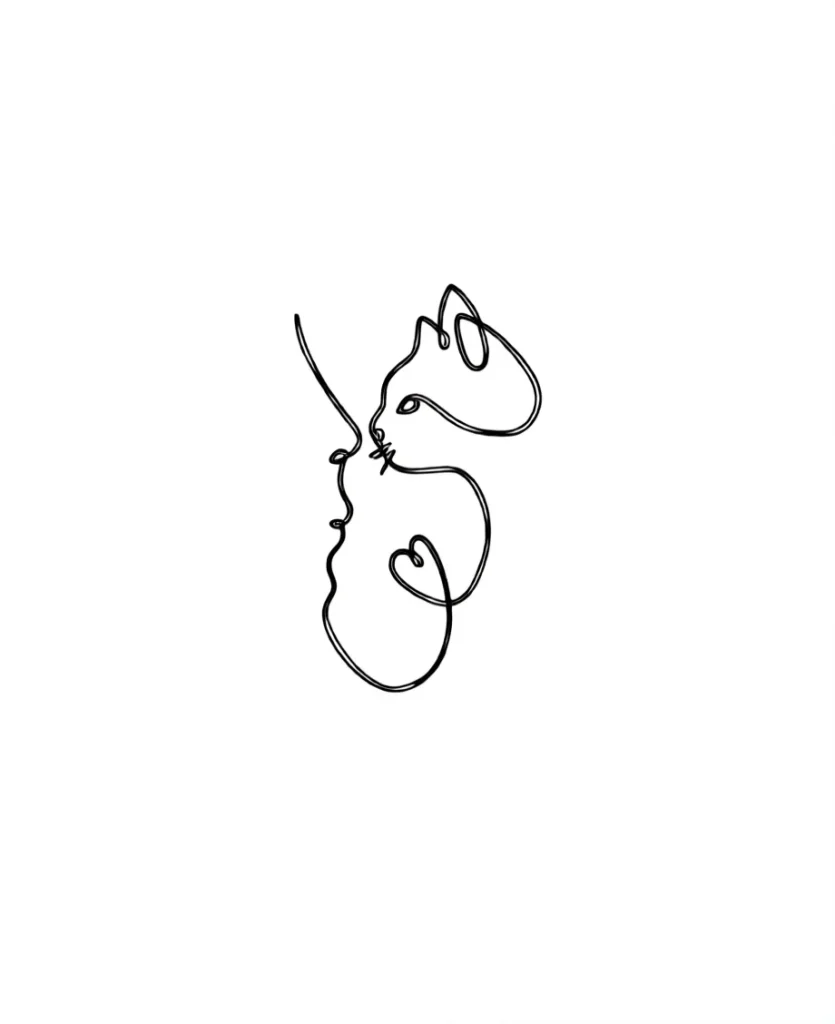 Minimalist tattoo on the shoulder blade: profiles of a woman and a cat, done in a single continuous line.