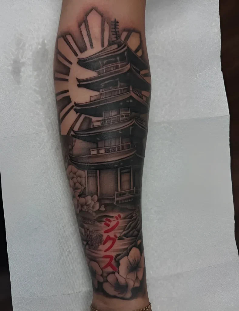 Black and grey realistic tattoo of a pagoda on the forearm with blooming sakura and hieroglyphs, done in realism style.