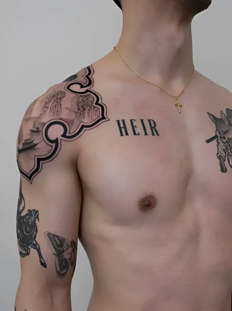 Man's tattoo on the deltoid muscle: Japanese landscape with mountains, clouds, and a ship, framed by a decorative border, and the word 'HEIR' on the chest.