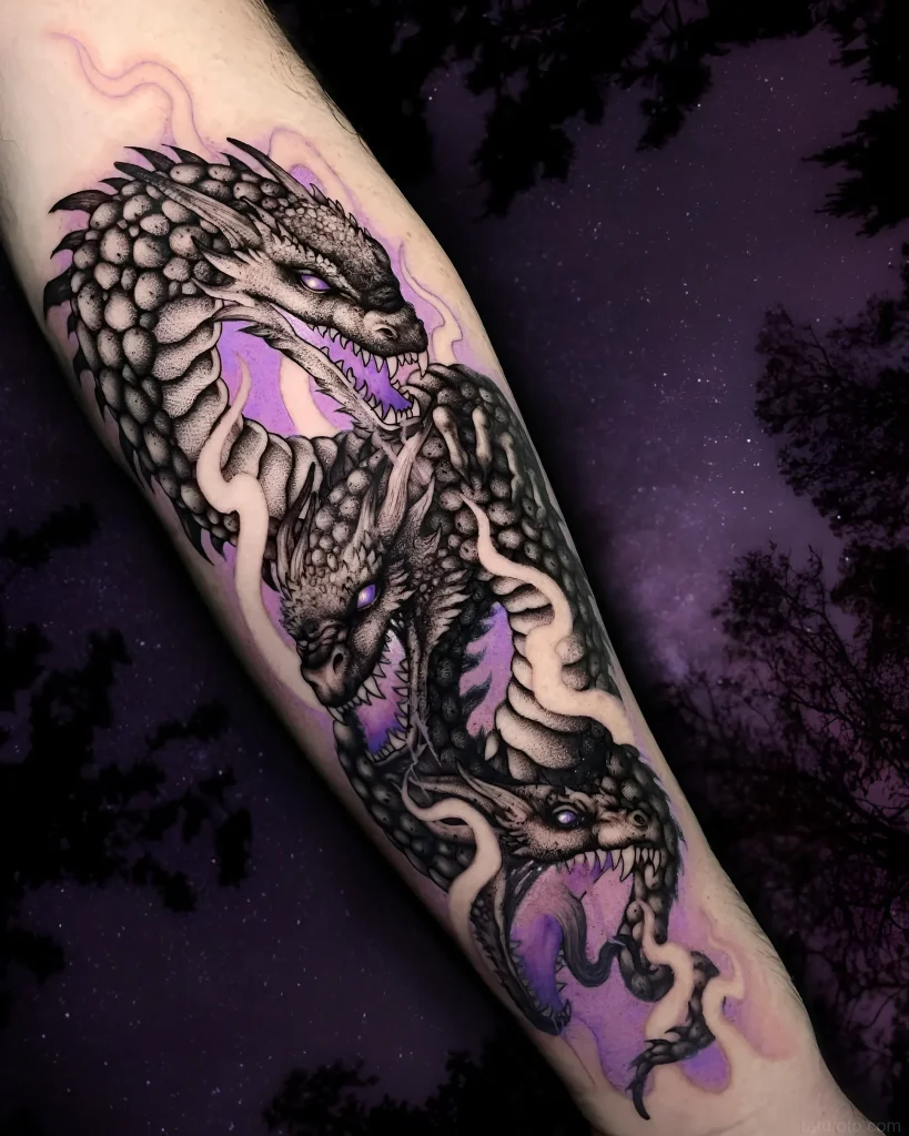 Hydra tattoo on the forearm in blackwork style with purple accents, depicting a multi-headed mythological creature.