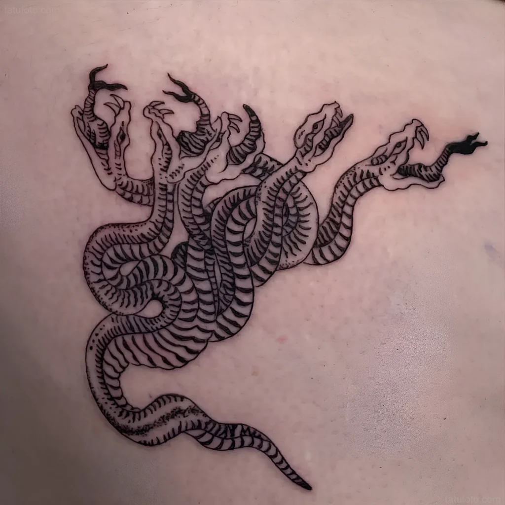 Black and white linework tattoo of a multi-headed Hydra with clawed paws