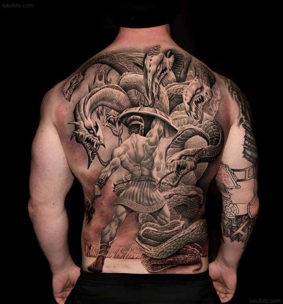 Black and white tattoo on the back depicting Hercules fighting the multi-headed Hydra