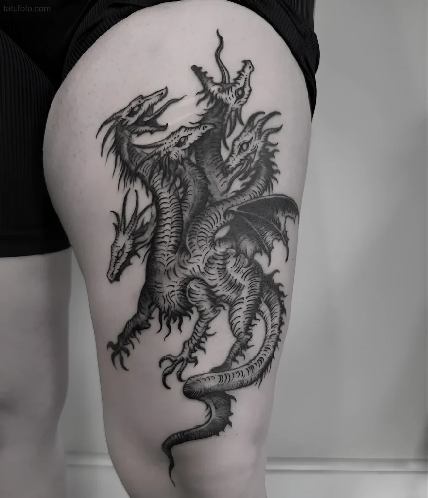Monochrome image of a multi-headed Hydra tattoo on the thigh