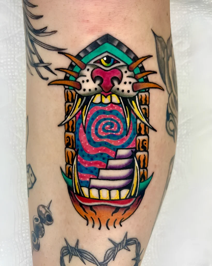 Bright American traditional style tattoo: stylized animal mouth with a spiral tunnel inside