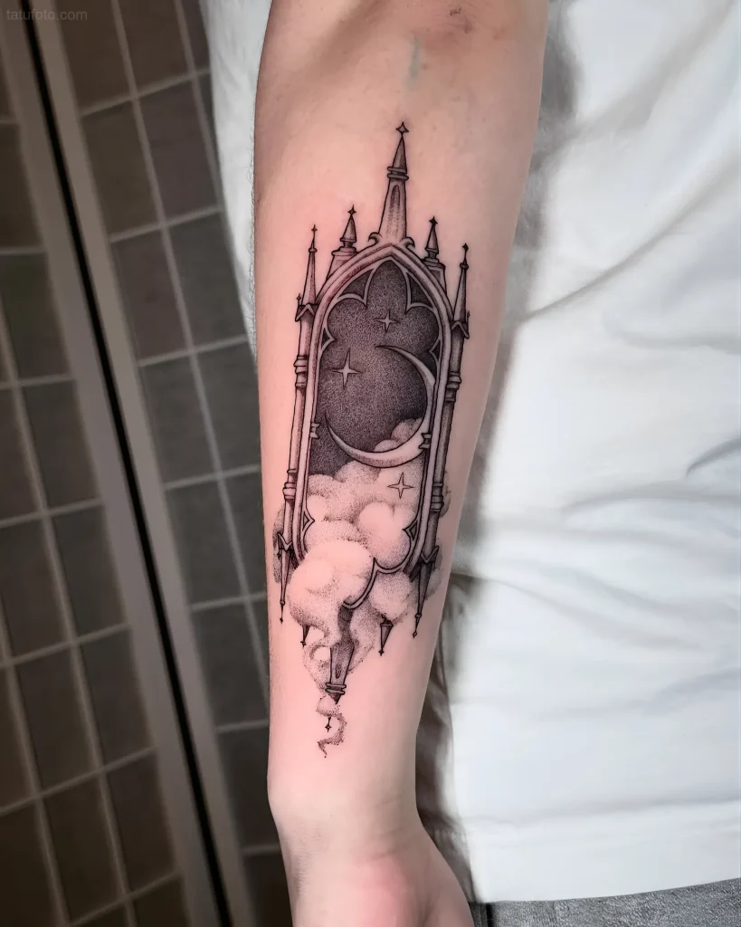 Gothic style tattoo depicting a portal with a moon, stars, and clouds