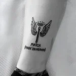Татуировка спички с крыльями ангела и надписью «Match (Made in Heaven)»