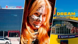 Журналистка Анастасия Смирнова с яркими татуировками на лице перед зданиями торговых центров Cherry Mall и Dream Yellow