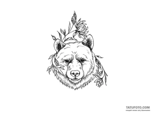 Тату-эскиз медведя, окруженного ветвями с цветами, в стиле графики.